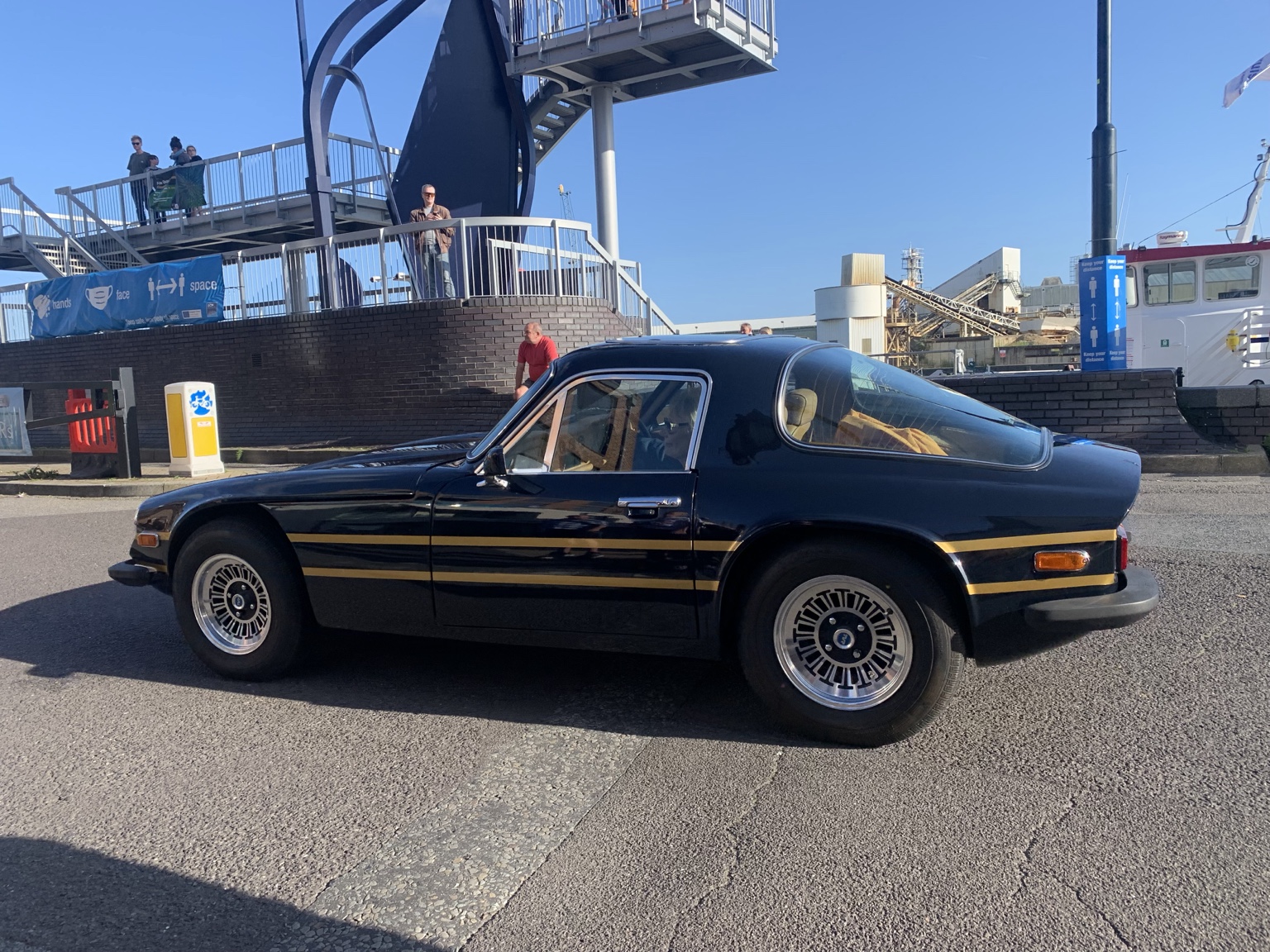 Black and gold classic sports car on Poole Quay