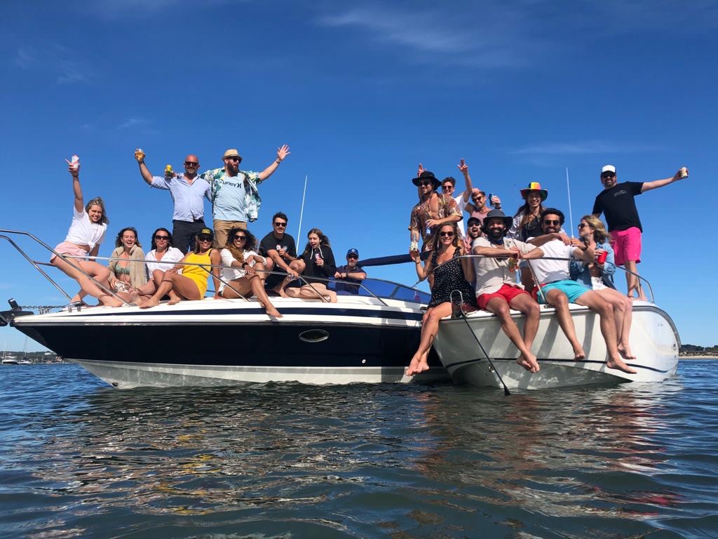 Friends enjoying a sunny day on boats