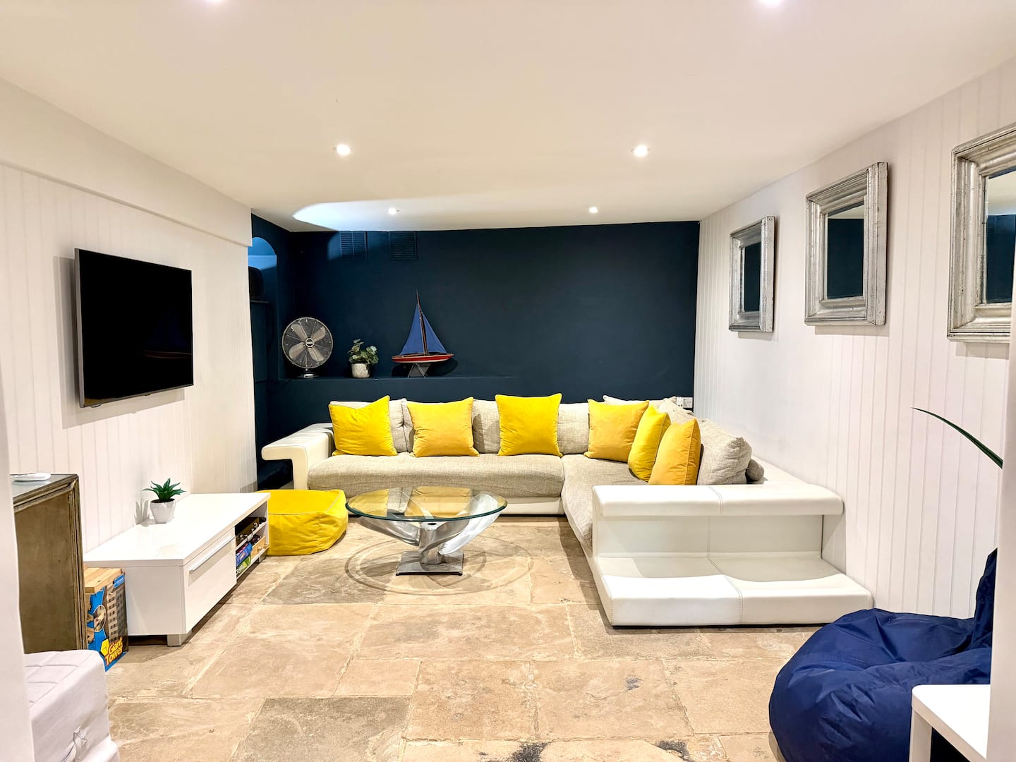 Basement snug with sofa and television