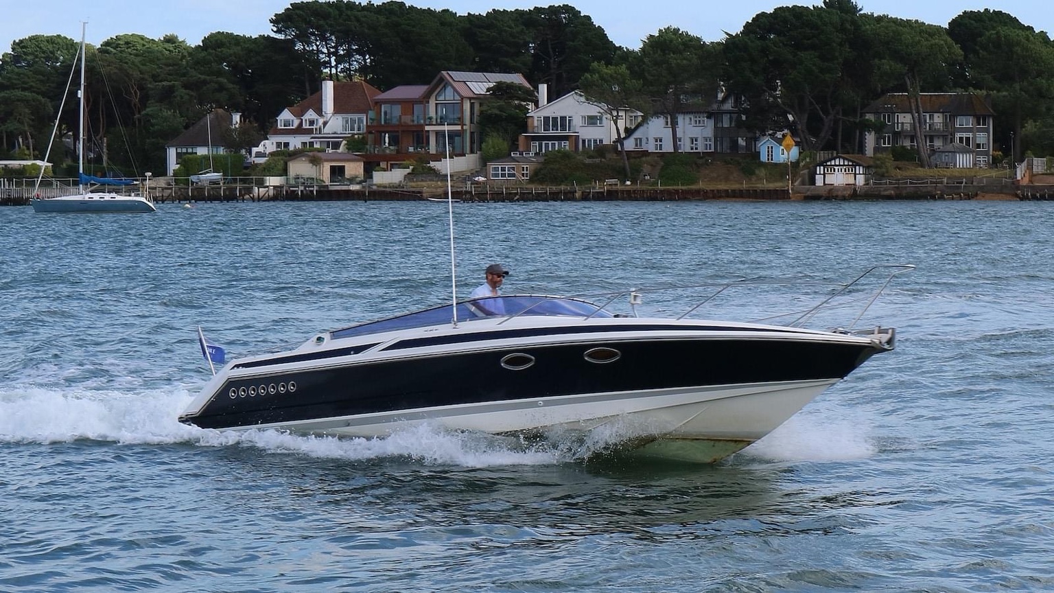 Motorboat cruising through Poole Harbour
