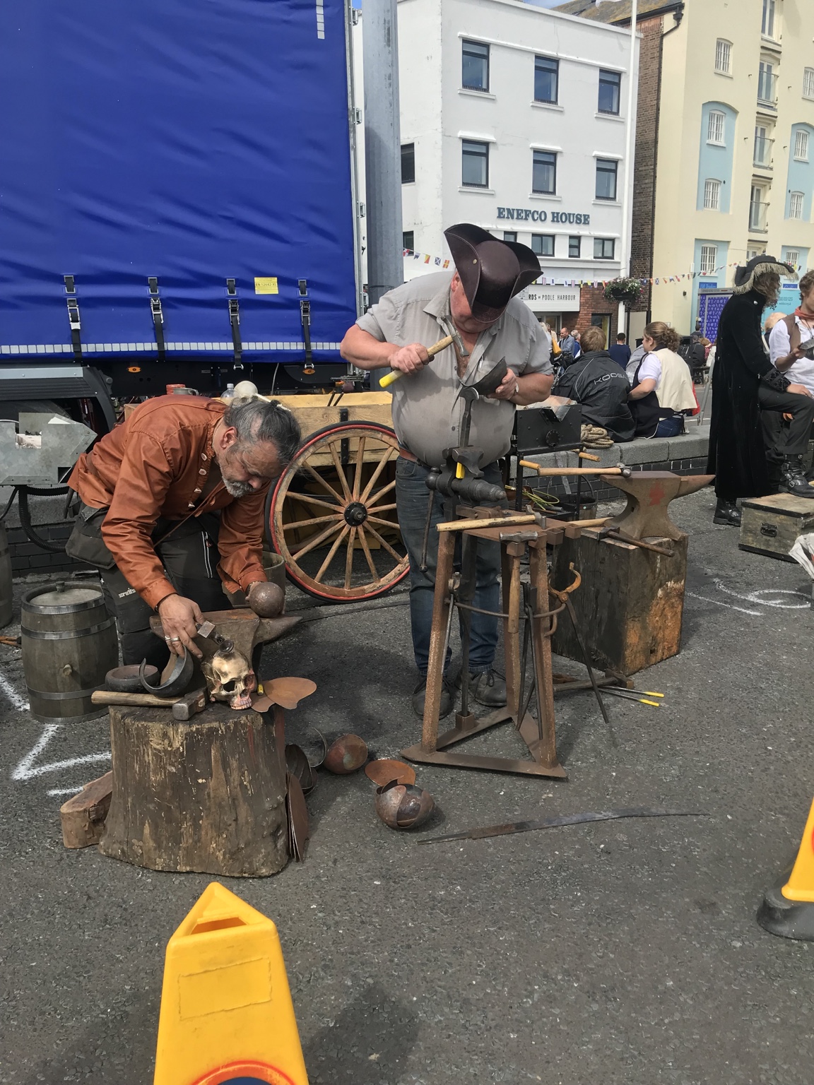 Pirate characters demonstrating metalwork on Poole Quay