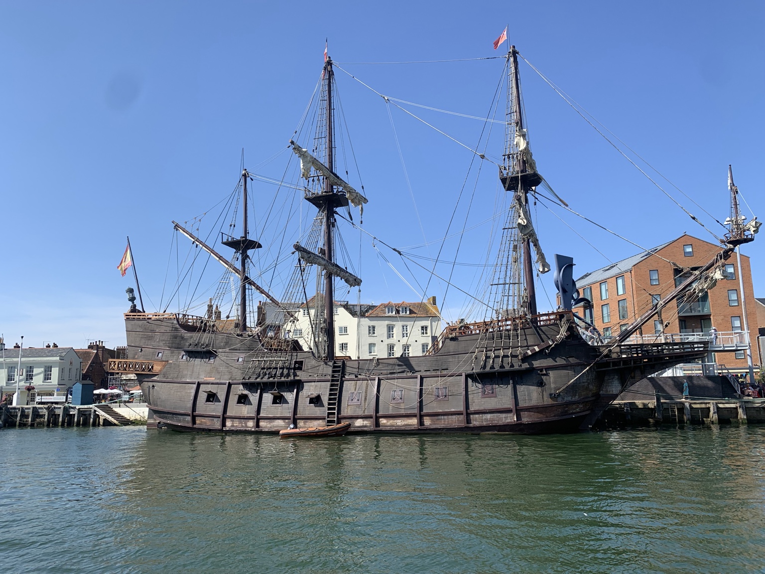A traditional tall ship moored beside Poole Quay